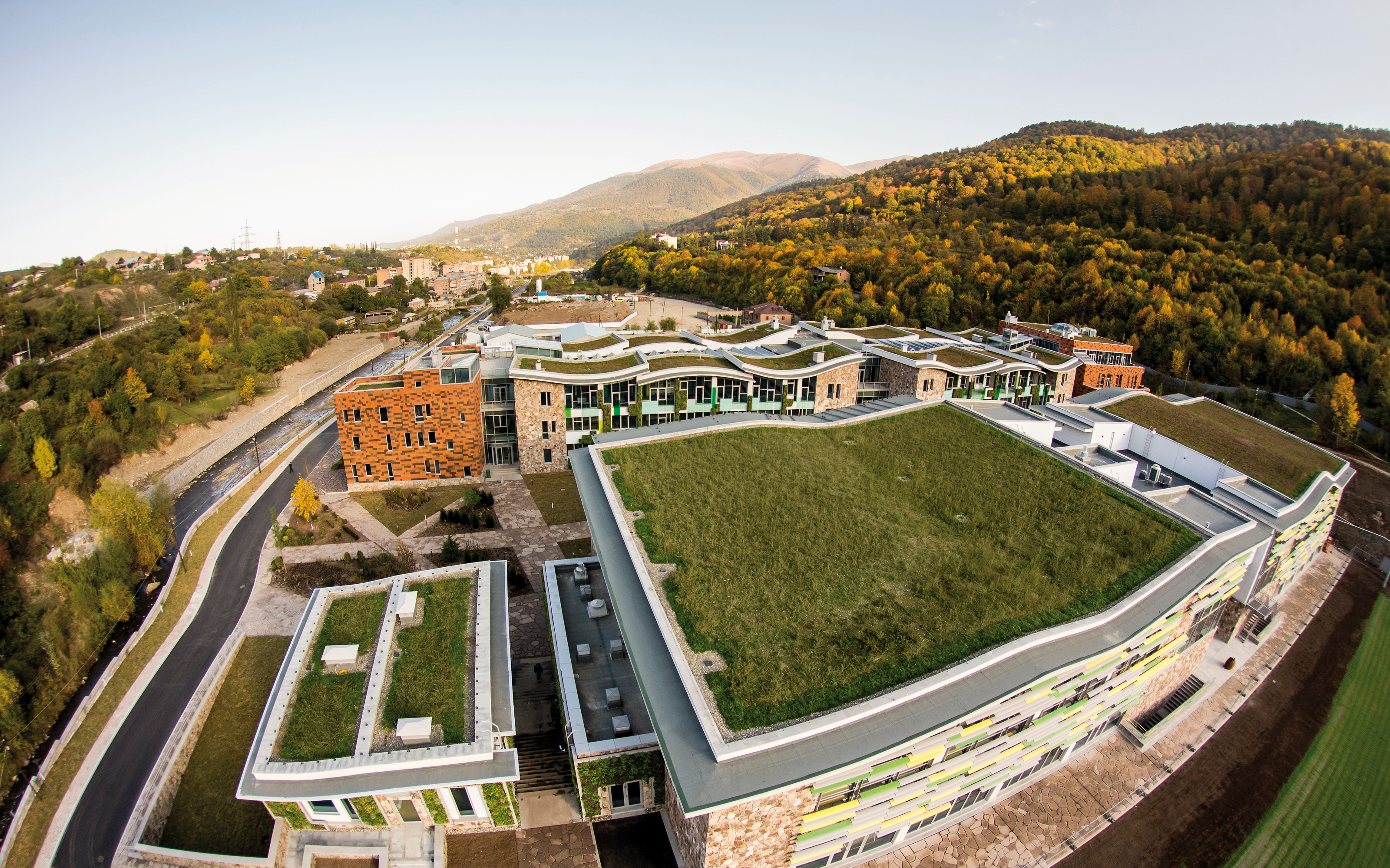 The green roofs ensure that the buildings blend into the surrounding National Park. © Danil Kolodin Bird`s eye view of vegetated areas on the roof